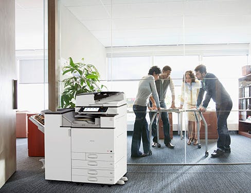 Office employees using printer.