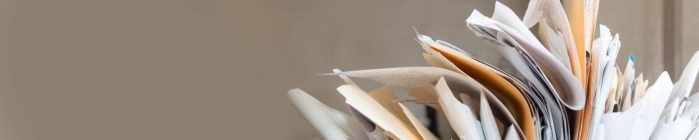 disorganized, messy folders with paper overflowing