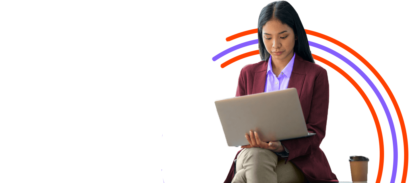 Woman sitting working on a laptop with Laserfiche software