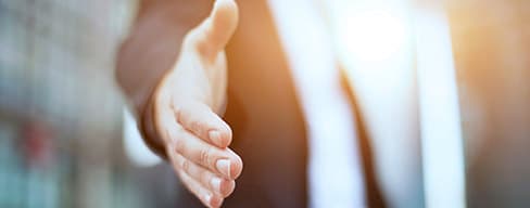 Closeup photo of a man with an outstretched hand.