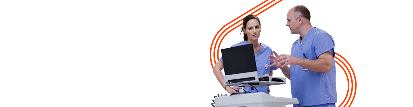 Two medical professionals looking at how Ricoh Electronic Data Exchange helps with clinical systems and data integration.