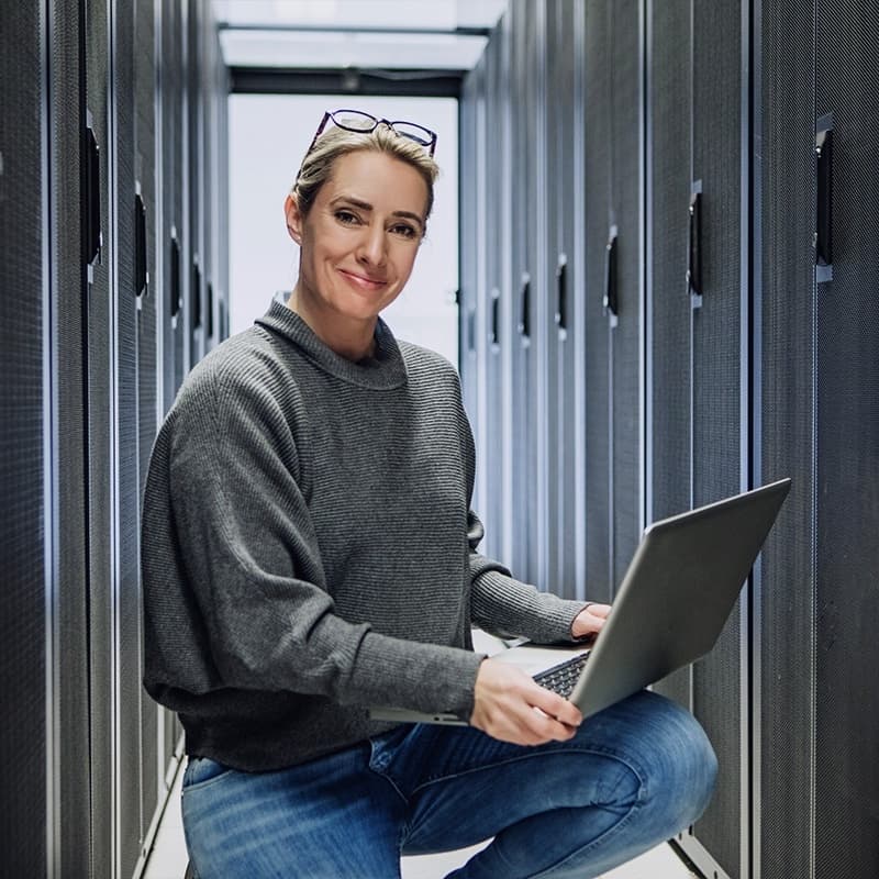 Woman working in a server room