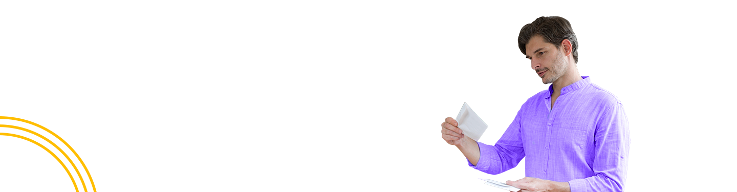 Man looking at mail envelope