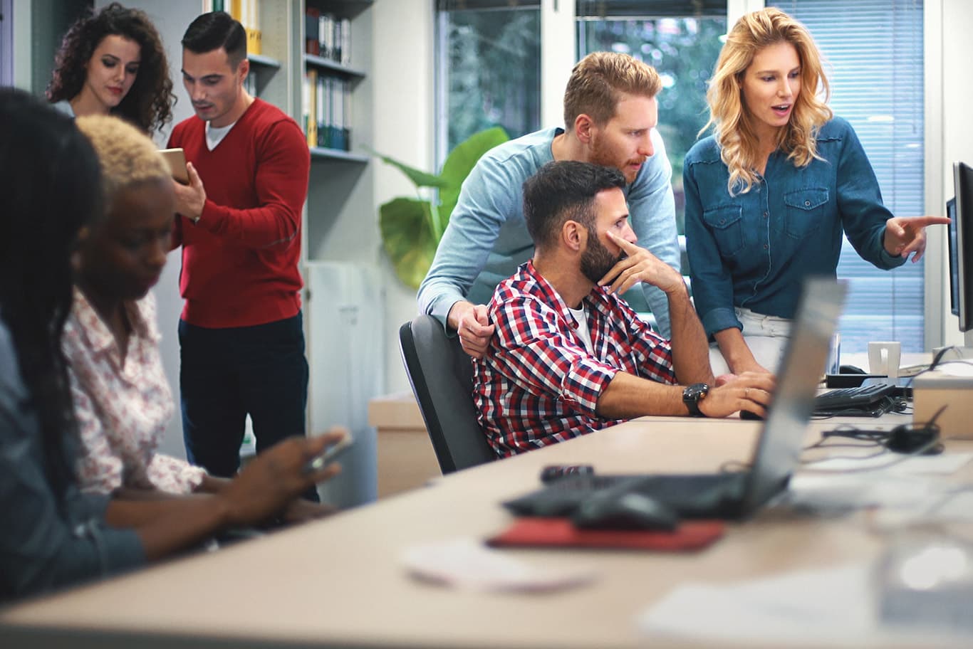 people working in small office
