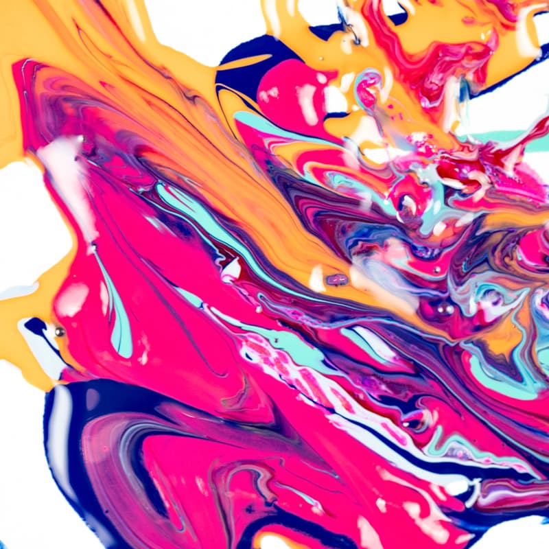 Bright colored ink o a piece of paper