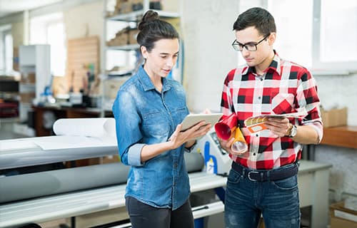 Printing experts discussing design and paper