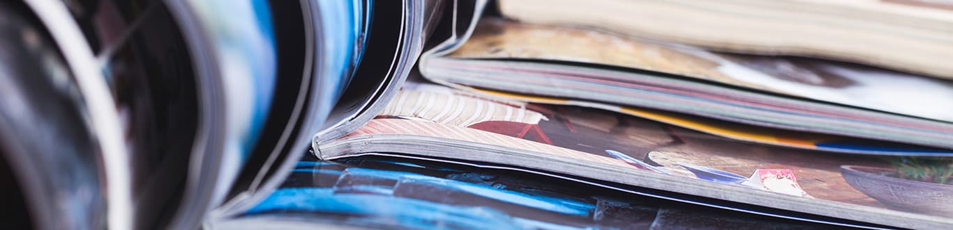 Stack of open magazines