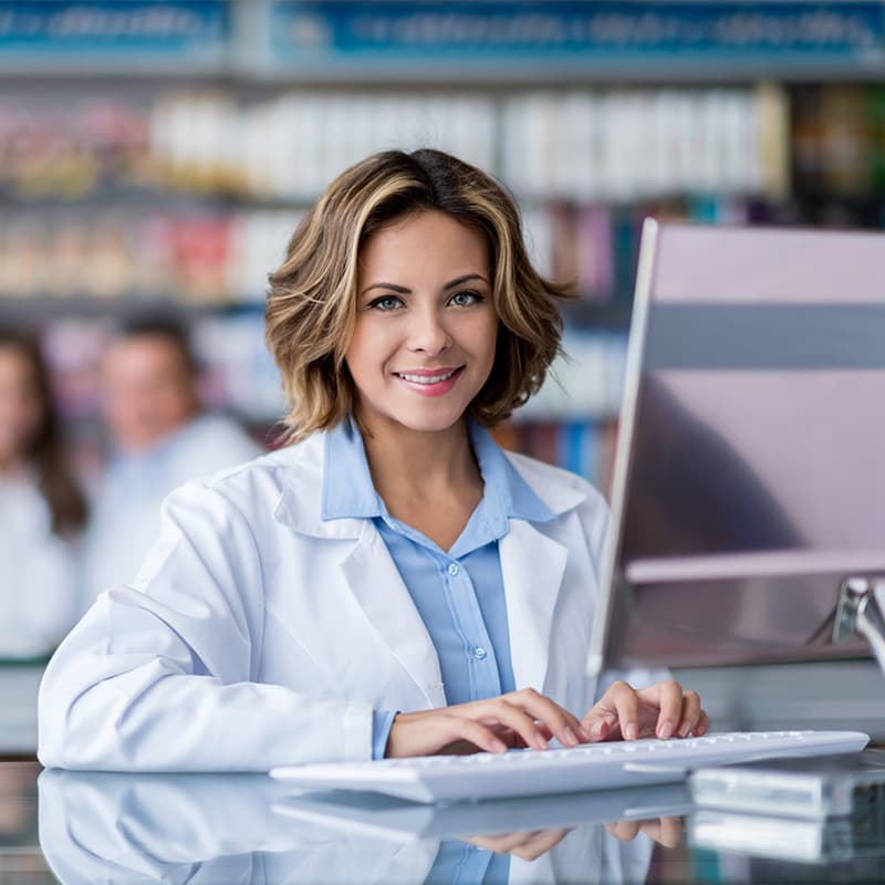 Female medical professional working on desktop